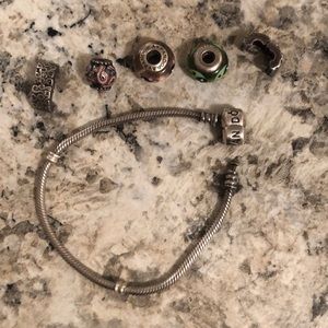 Pandora bracelet with end stoppers and 3 charms
